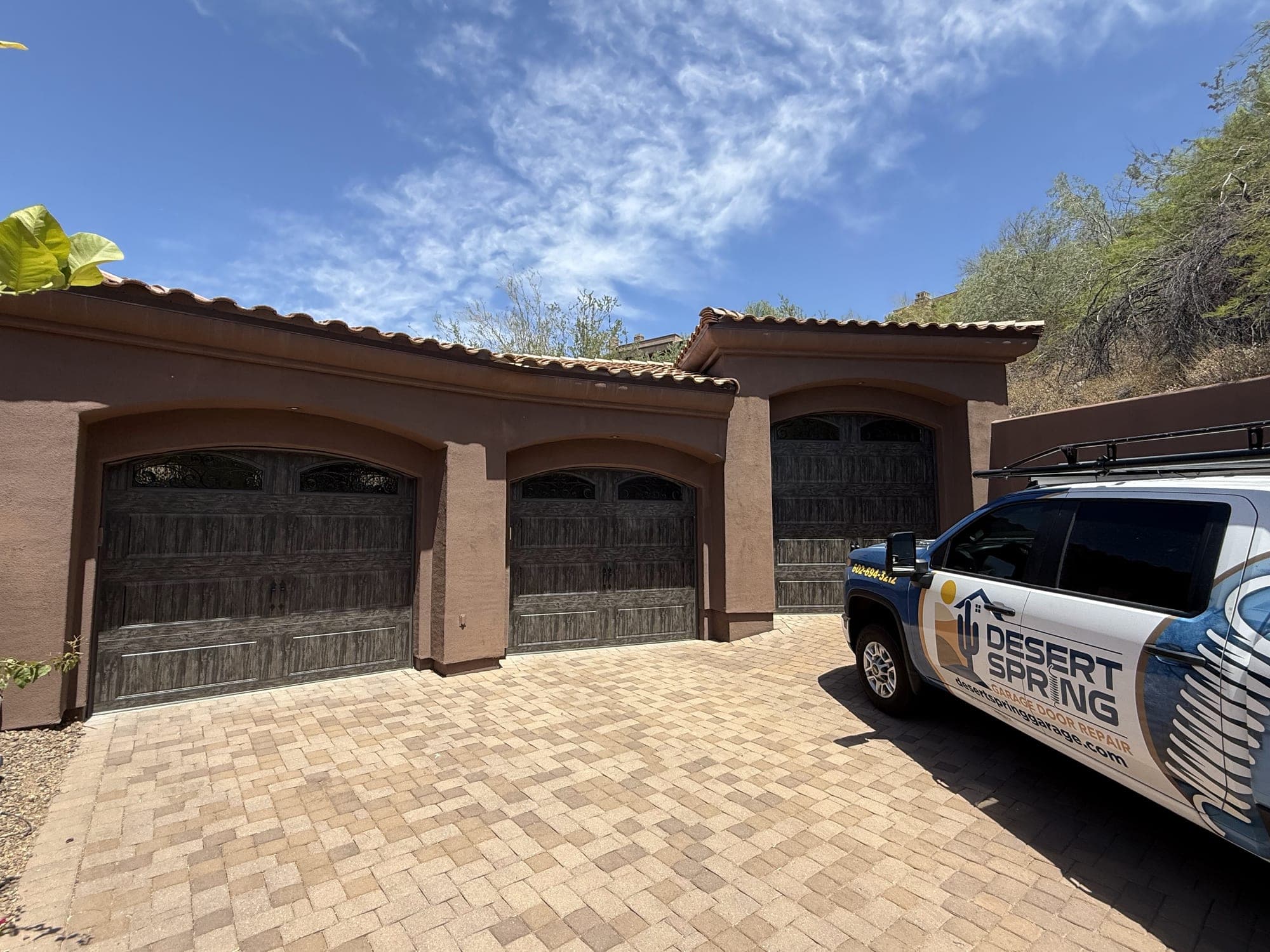 Garage Door Repair Gilbert Desert Spring Garage Door Repair truck at a Gilbert, AZ home