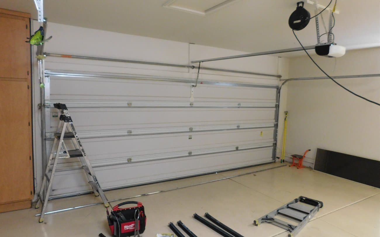 Garage Door Repair Gilbert Desert Spring technicians repairing a garage door in Gilbert, AZ