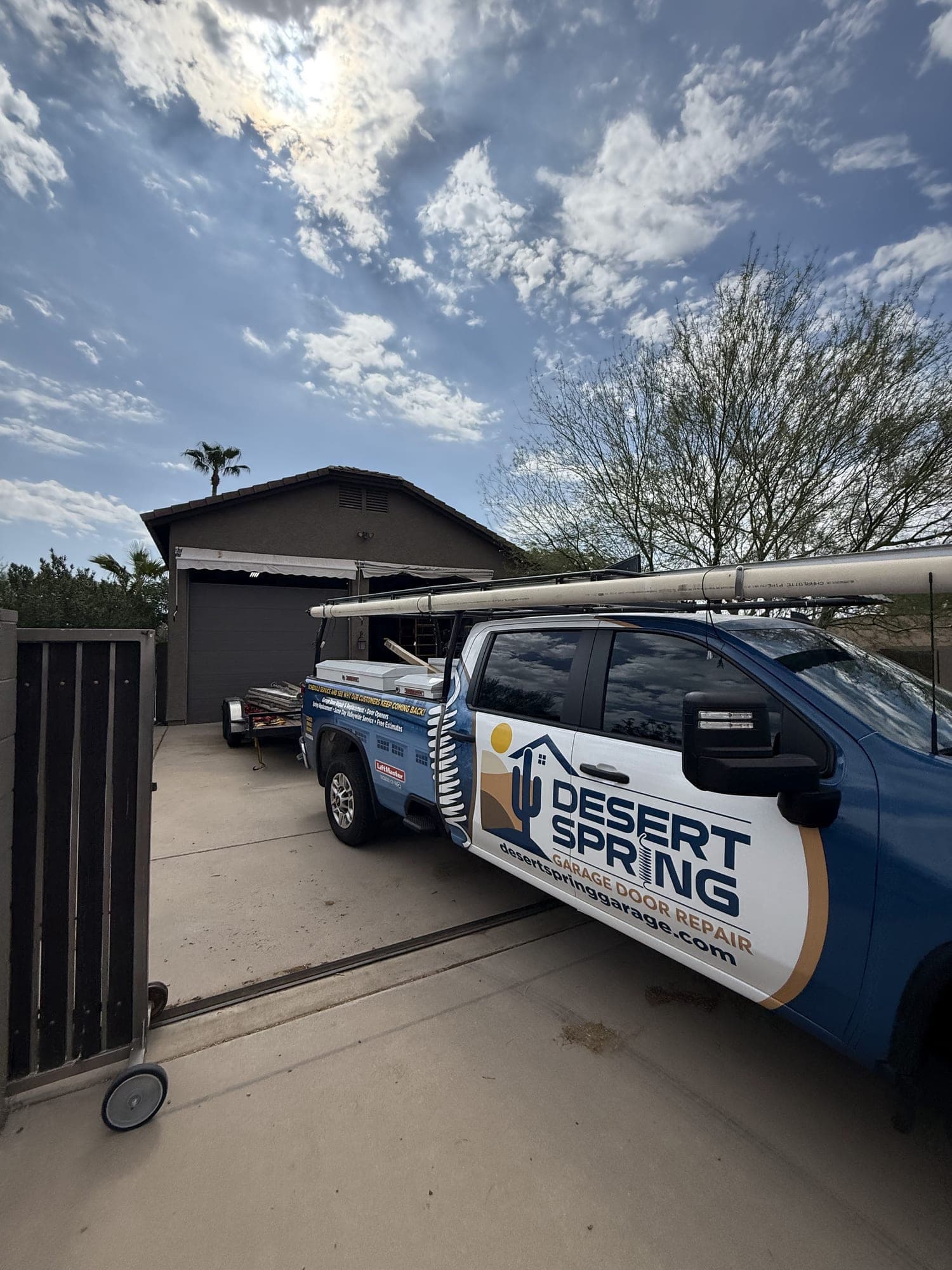 Garage Door Repair Glendale Desert Spring Garage Door Repair truck at a Glendale, AZ home after a new garage door installation