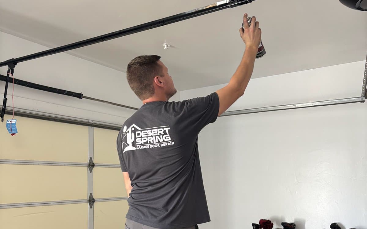 Garage Door Maintenance New River Desert Spring technician performing a garage door tune-up in New River, AZ