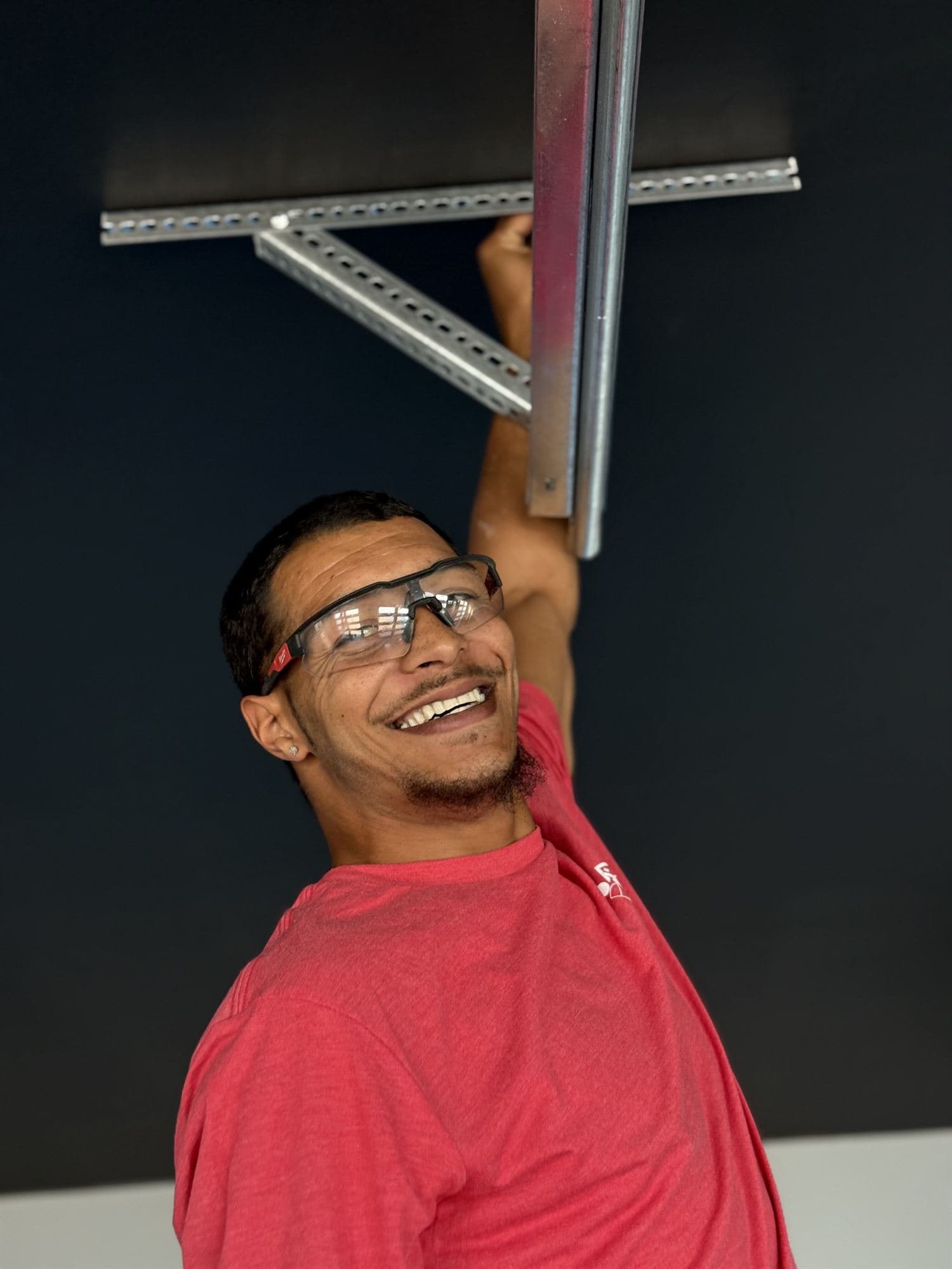 Garage Door Spring Repair Phoenix Smiling Desert Spring garage door technician on a job in Phoenix, AZ
