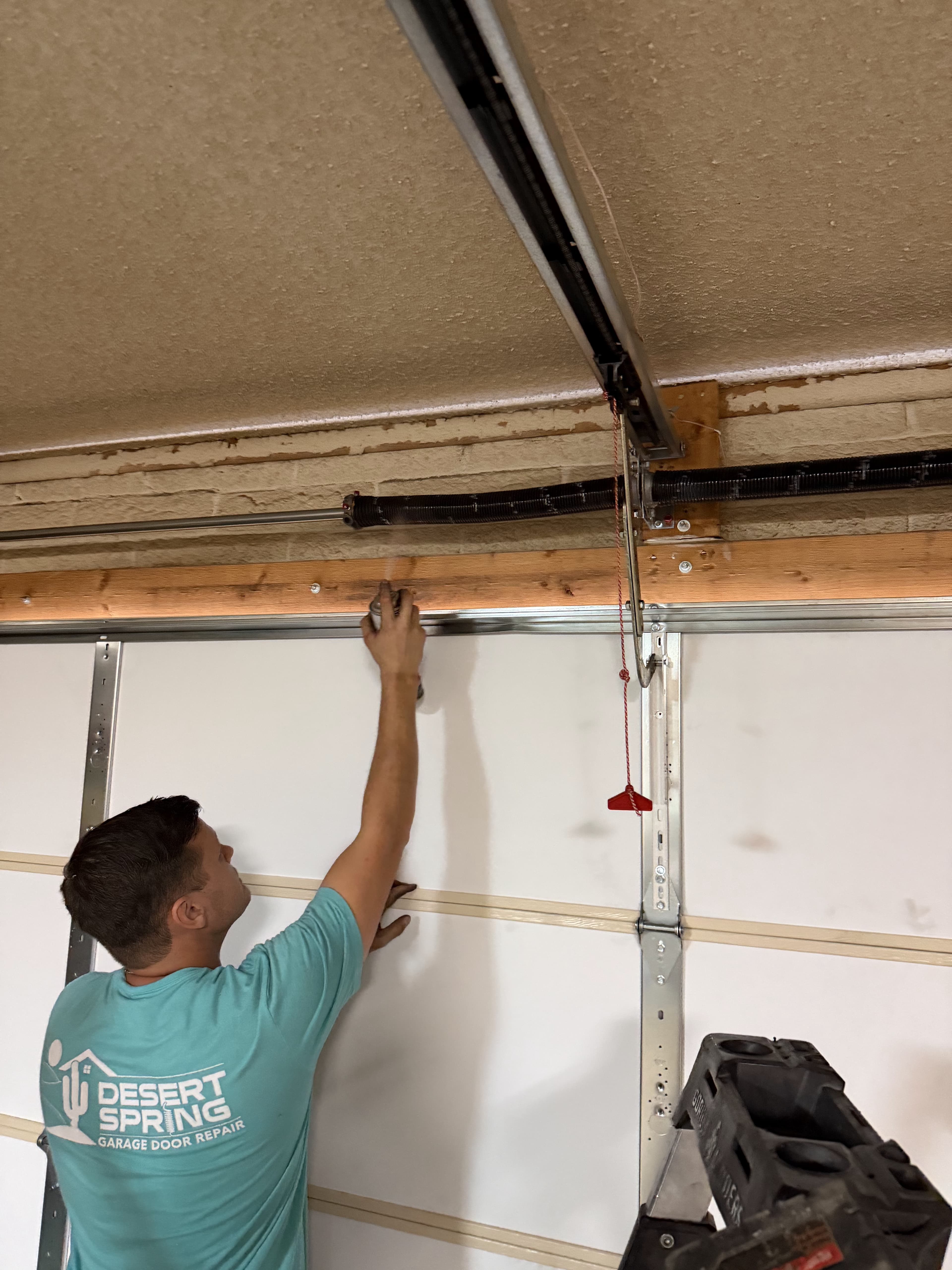 Friendly Desert Spring technician ready to service a garage door